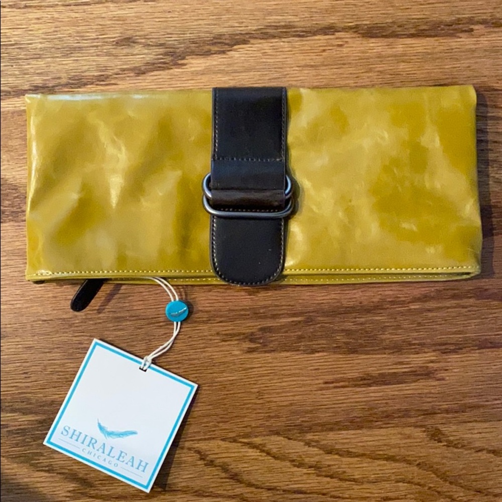 mustard color clutch brand new with tag